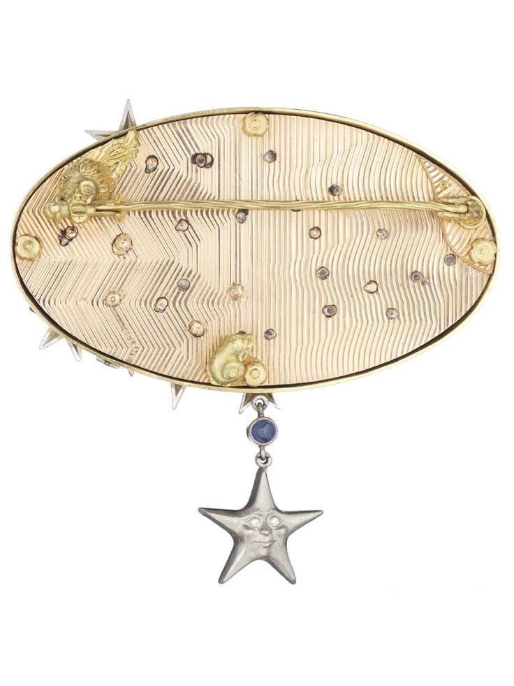 Anthony Lent's Hands to the Stars brooch features engine-turned engraving, ...
