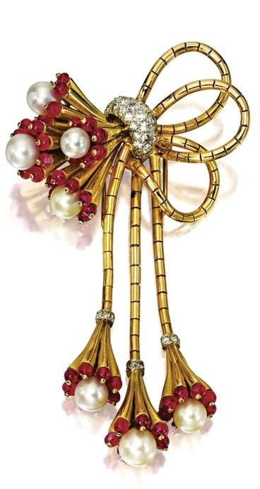 GOLD, CULTURED PEARL, RUBY AND DIAMOND BROOCH, CIRCA 1940 The fanciful bow of go...