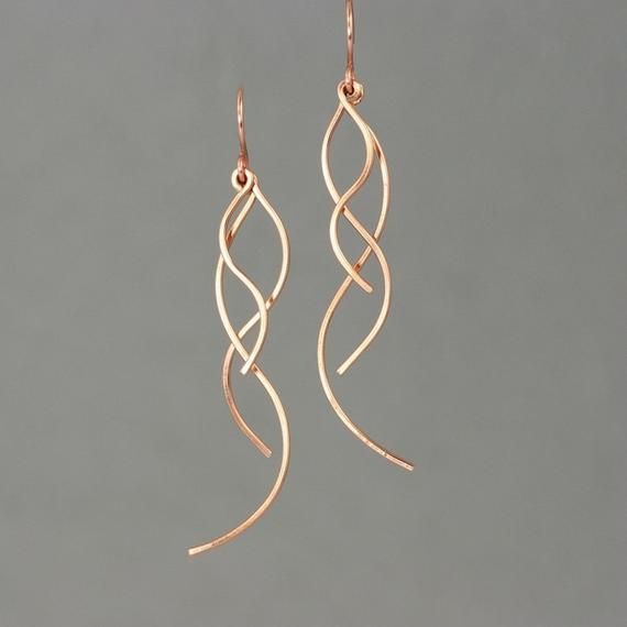 This unique dangling long earrings are handmade either from 14k rose gold filled...