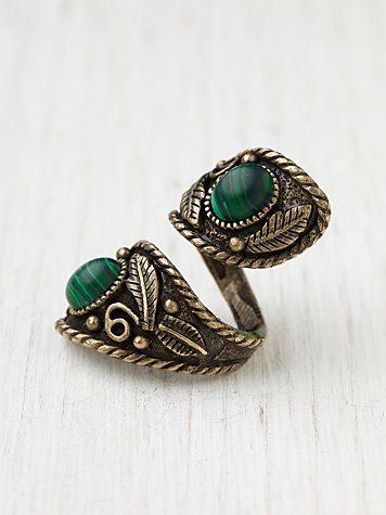 This Gold and Green Knuckle ring