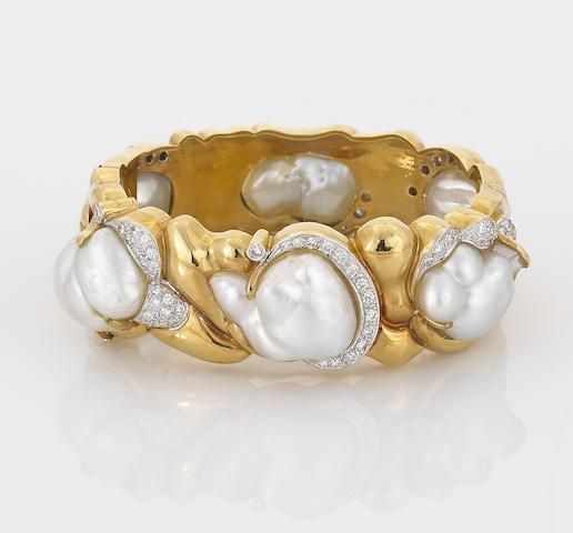 A cultured pearl and diamond bangle