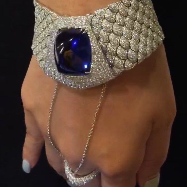 A spectacular tanzanite set among a sea of diamonds to create a silky bracelet w...