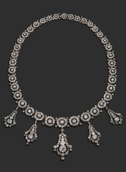 A late Victorian diamond necklace, formed with graduated circular links, each ce...