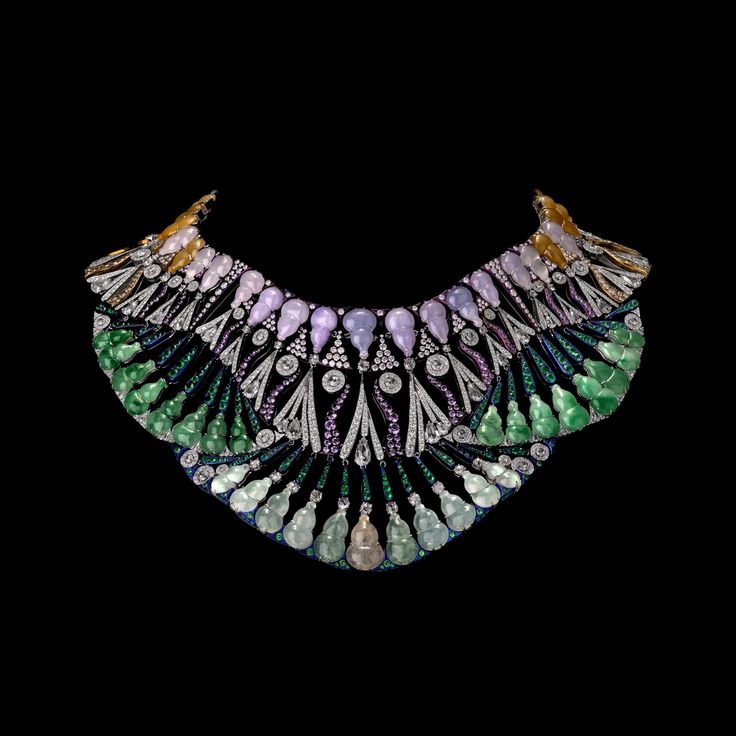 Pharaonic bib necklace from Carnet by Michelle Ong, incorporating a lively green...