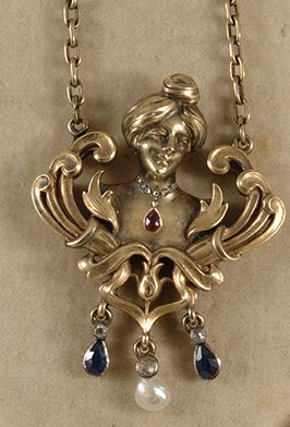 Ruby, sapphire, diamond, pearl and gold pendant, depicting a woman wearing a nec...