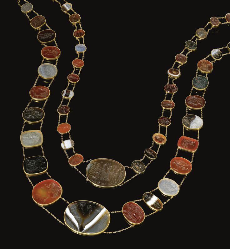 Two gold and hardstone intaglio necklaces,  Circa 1820  The first set with forty...