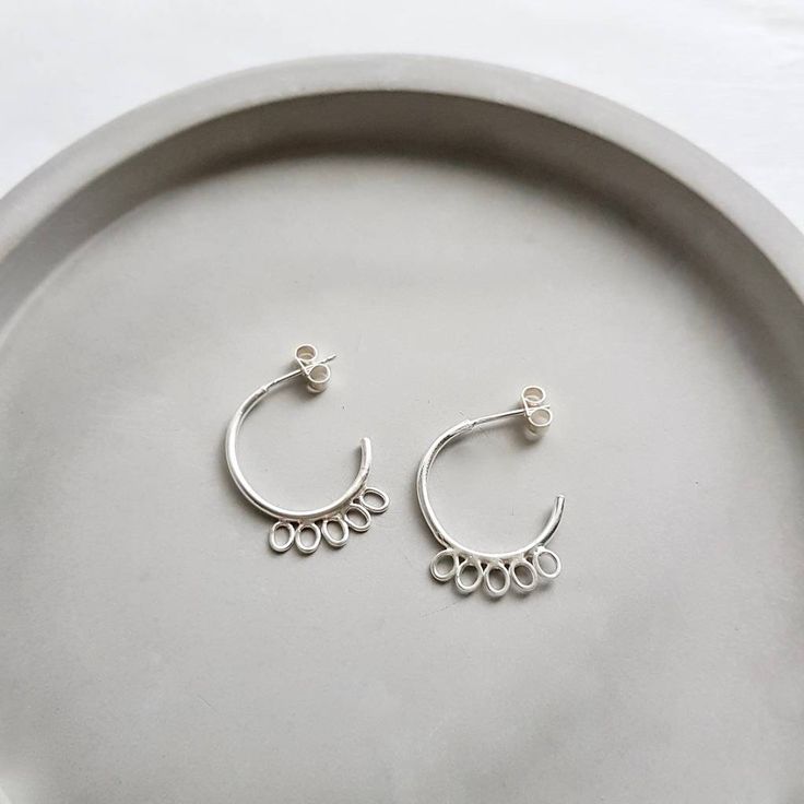 I've just found Handmade Silver Petal Open Hoops. A pretty pair of handmade ...