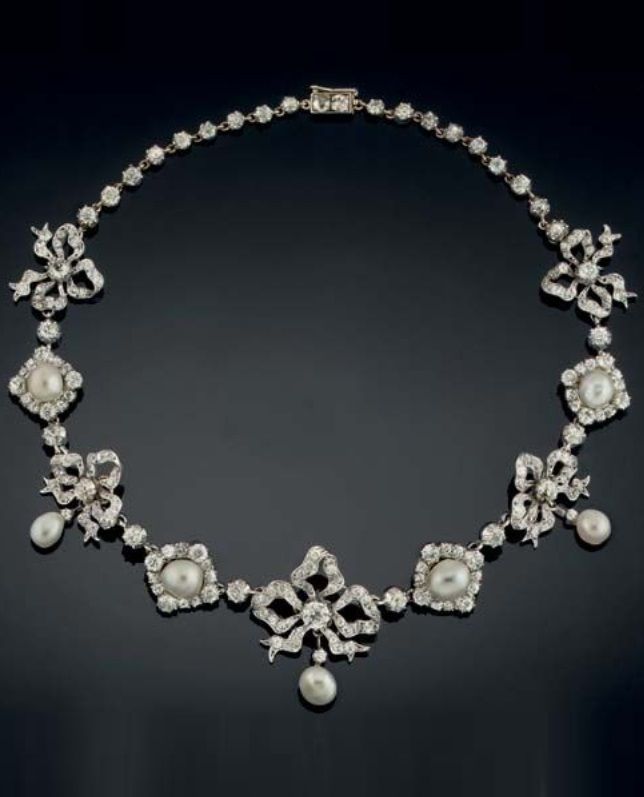 A late Victorian pearl and diamond necklace, circa 1890. Composed of a series of...