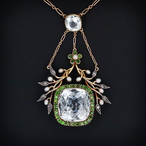 Aquamarine, garnet, diamond and pearl necklace, circa 1890.