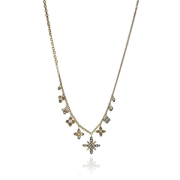 Diamond and gold star charm necklace.