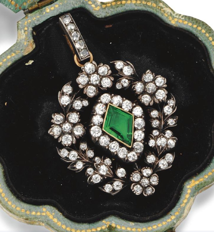 Emerald and diamond pendant.