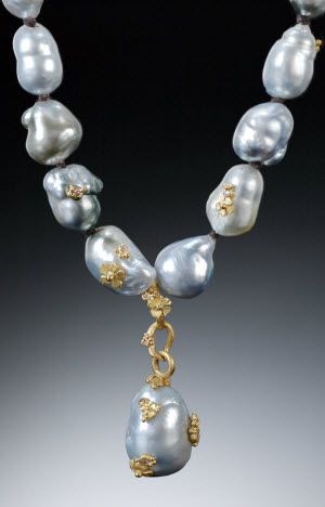 Necklace made of baroque pearls, decorated with gold accents.