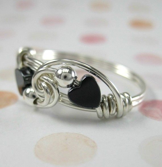 Wire wrapped sweetheart ring in sterling silver with hematite hearts.  A sweethe...