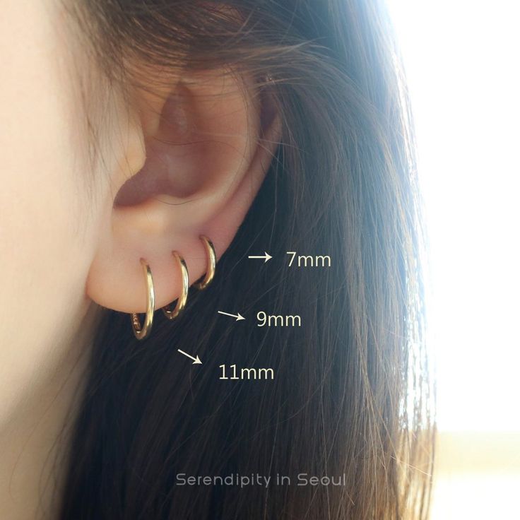 layering simple slim hoop earrings in 14k gold