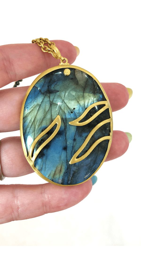 An exquisite labradorite and gold pendant necklace by Lika Behar.