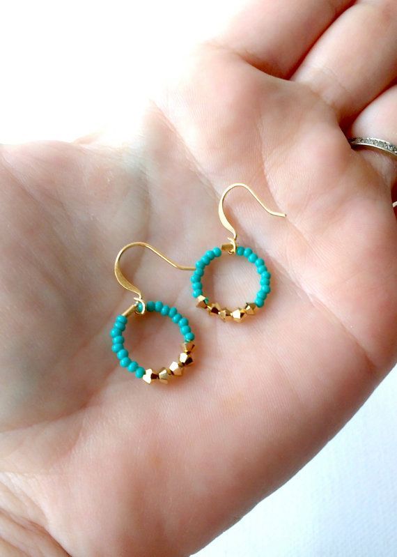 These dainty and tiny hoop earrings are made with turquoise color seed beads and...