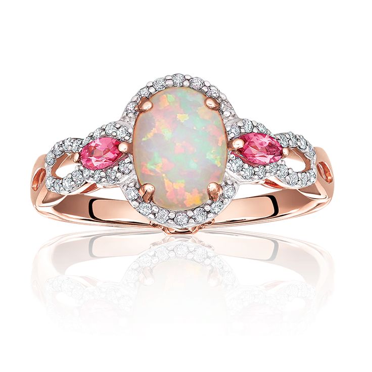 This beautiful ring features an oval opal center surrounded by 46 diamonds and a...