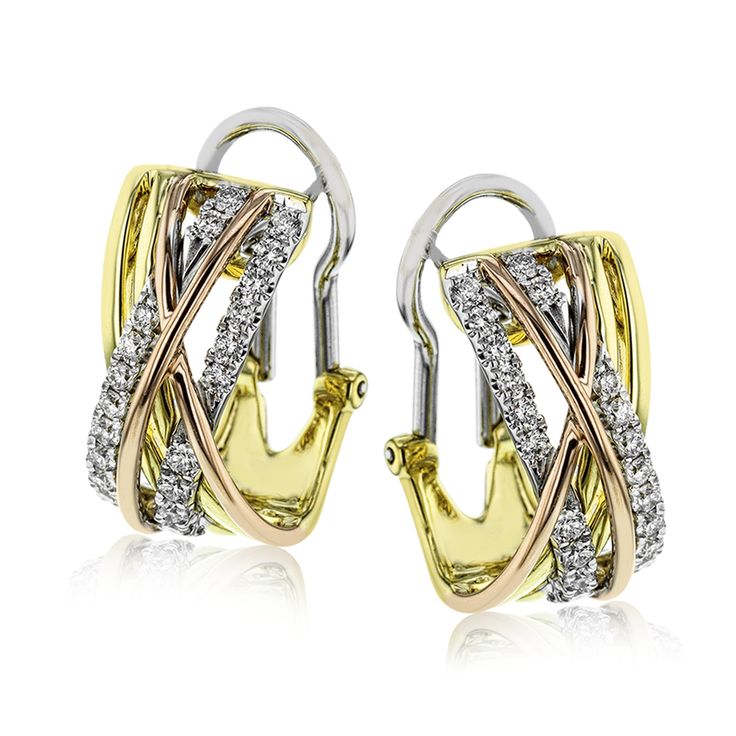 These gorgeous, contemporary earrings glimmer with .74 ctw of round white diamon...