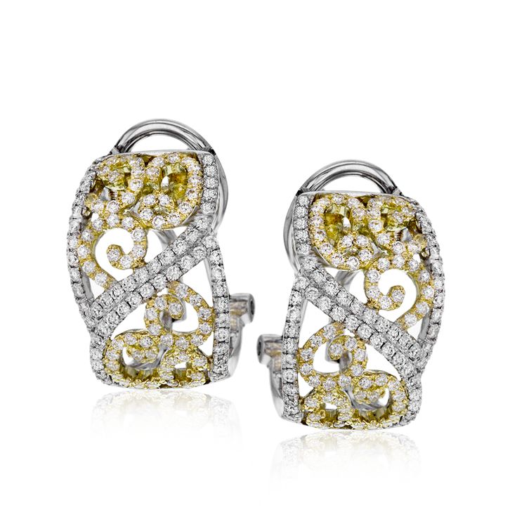 These lovely, intricate earrings combine the both 18k yellow and white gold, cre...